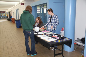 DMACC United booth informing students and faculty about the Diversity Commission's decision to continue supporting the LGBTQ Alliance Conference