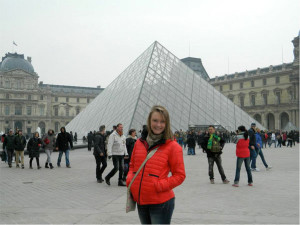 DMACC student Kaitlin Hartman standing outside the Louvre in Paris.
