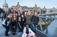 The Spring 2019 study abroad class stands on bridge in London.