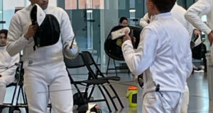 Derek Jenson (left) prepares to bout with a player from the University of Minnesota. Photo Courtesy Connie James.