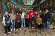 The 2025 London Study Abroad group pose in Covent Garden, London.