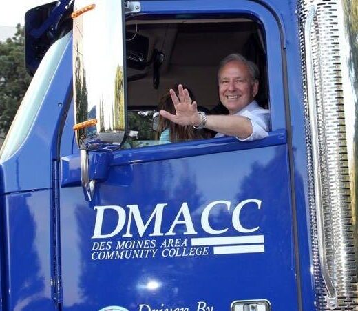 DMACC President Rob Denson driving the DMACC semi truck. Photo courtesy DMACC.
